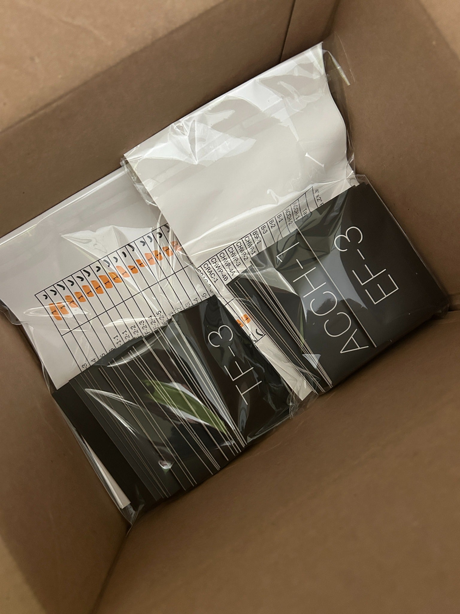 Boxed commercial label order with engraved acrylic tags and schedule