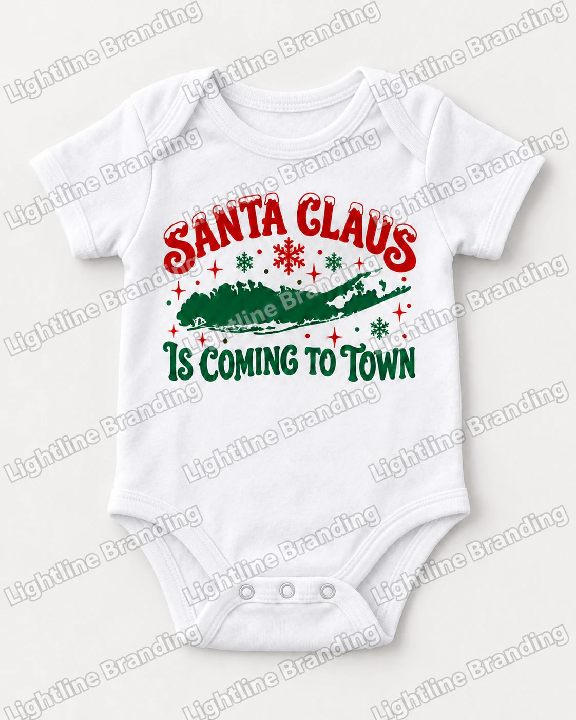 White baby bodysuit mockup with red and green Santa Claus Is Coming to Town Long Island artwork.